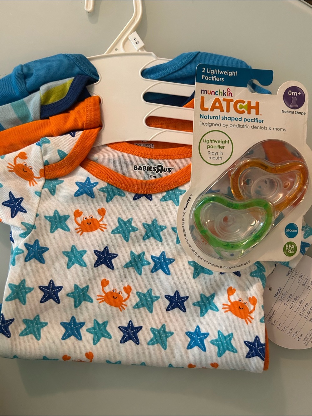 Babies"R"Us Crab & Starfish Baby Onesie with Orange Trim and munchkin pacifier